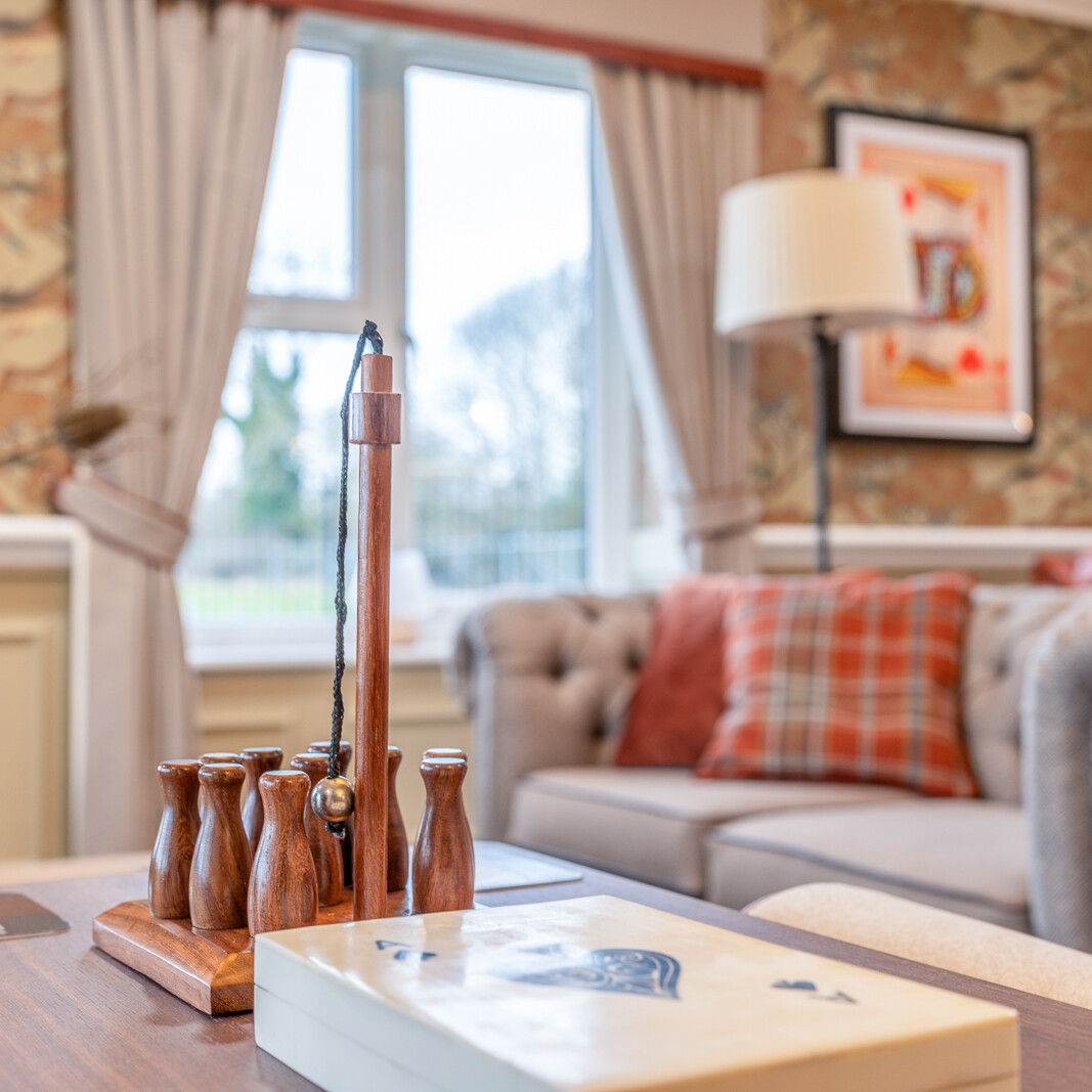 Comfortable residents' lounge with seating and natural light