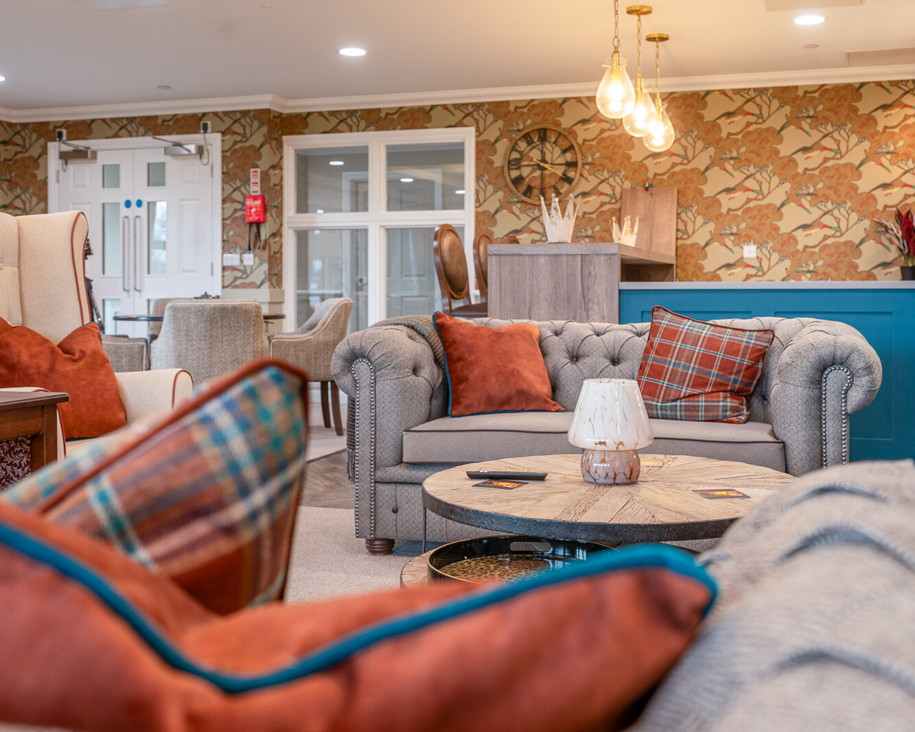Comfortable residents' lounge with seating and natural light