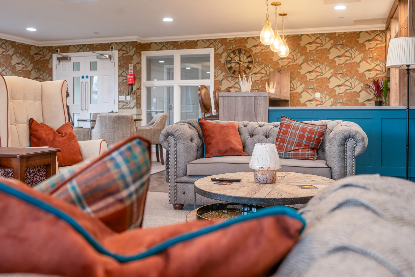 Comfortable residents' lounge with seating and natural light